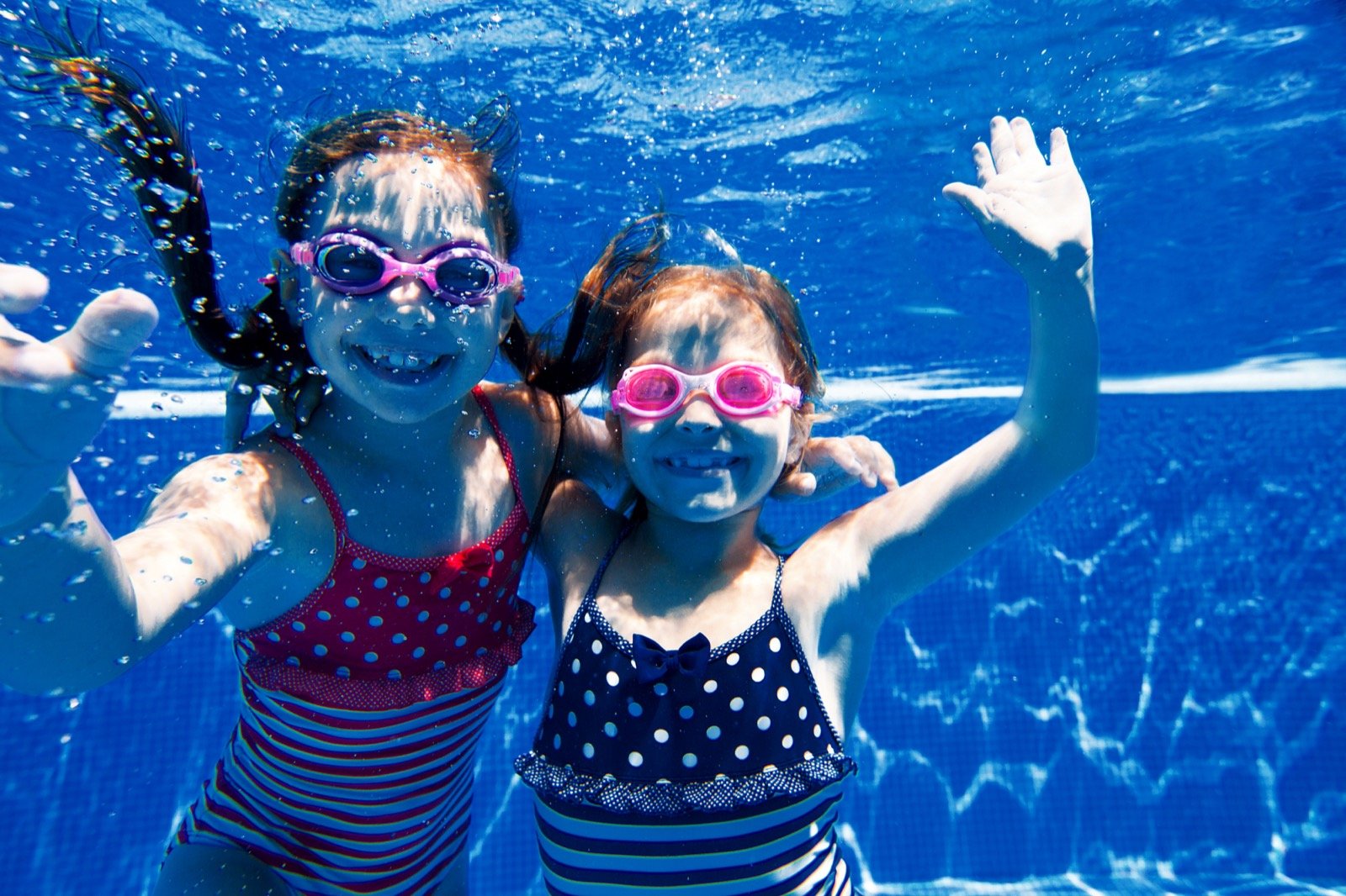 Kids smiling underwater